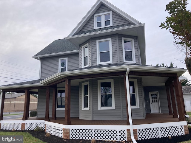 country-style home featuring covered porch