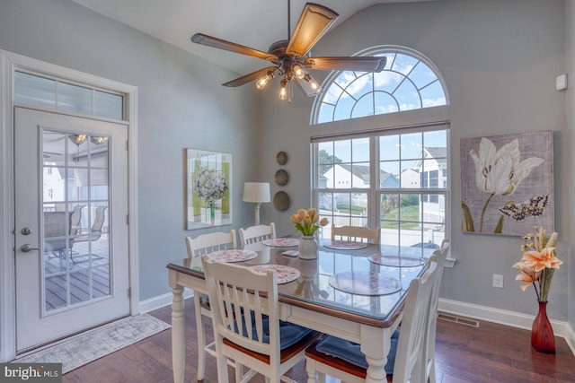 dining space featuring ceiling fan and dark hardwood / wood-style floors