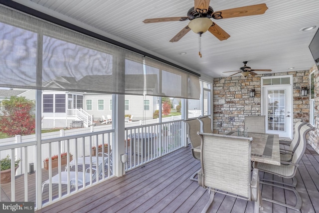 sunroom / solarium with ceiling fan