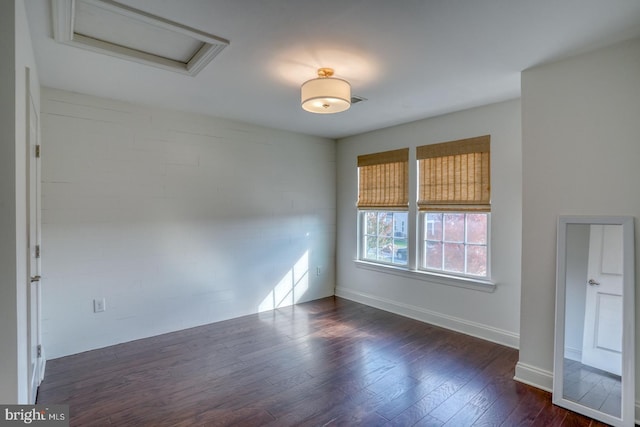 empty room featuring dark hardwood / wood-style floors