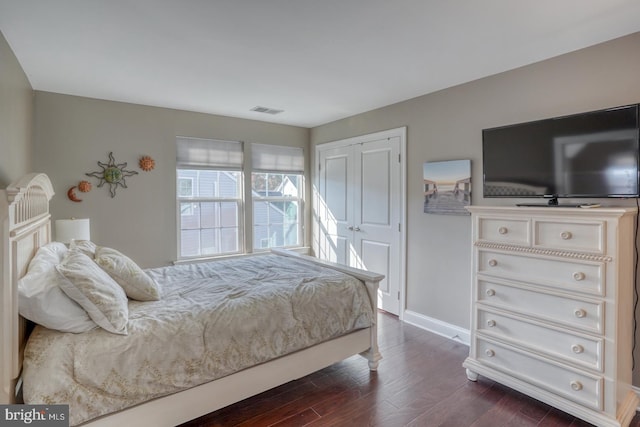 bedroom featuring dark wood-type flooring