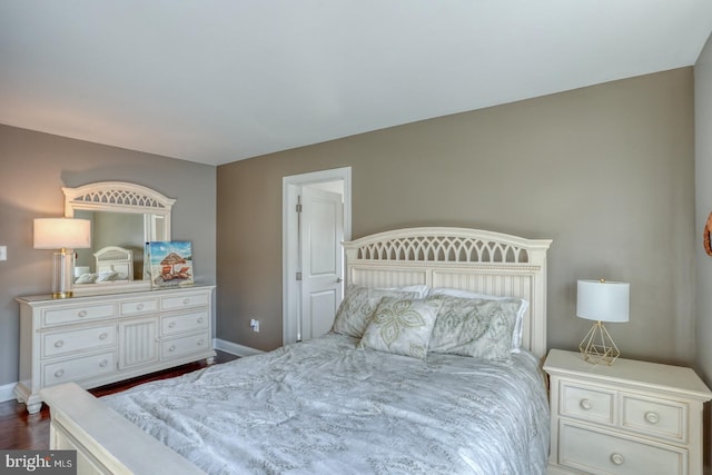 bedroom with hardwood / wood-style flooring