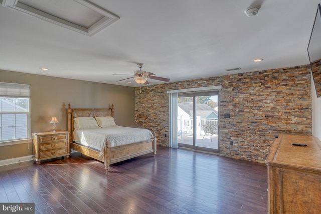 unfurnished bedroom featuring dark wood-type flooring, ceiling fan, and access to outside