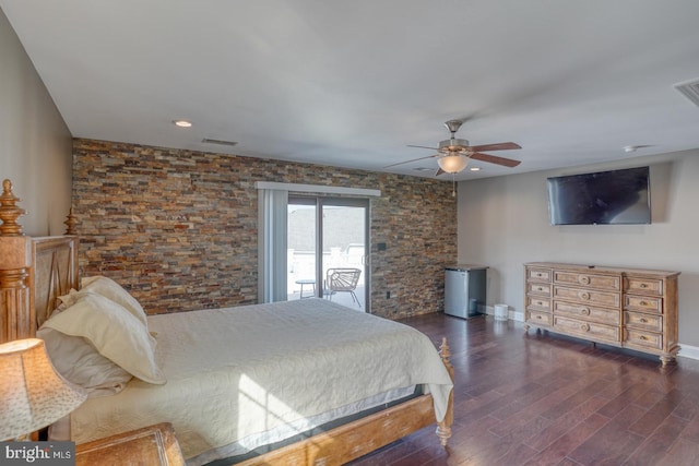 bedroom featuring dark hardwood / wood-style floors, access to outside, and ceiling fan