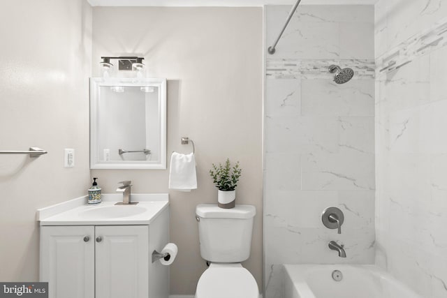 full bathroom featuring vanity, tiled shower / bath combo, and toilet