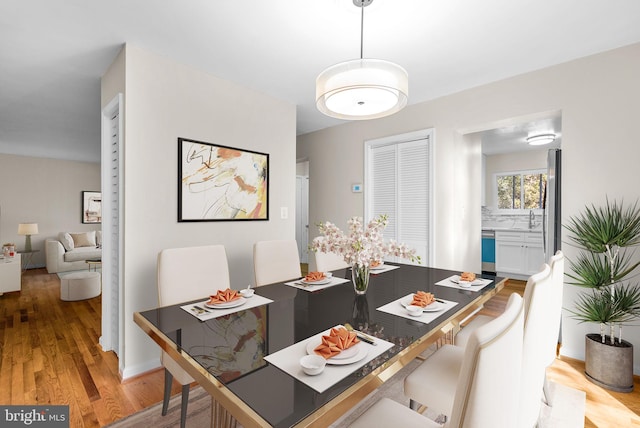 dining space with light wood finished floors
