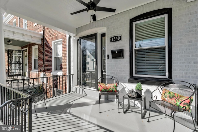 view of patio with ceiling fan and a porch