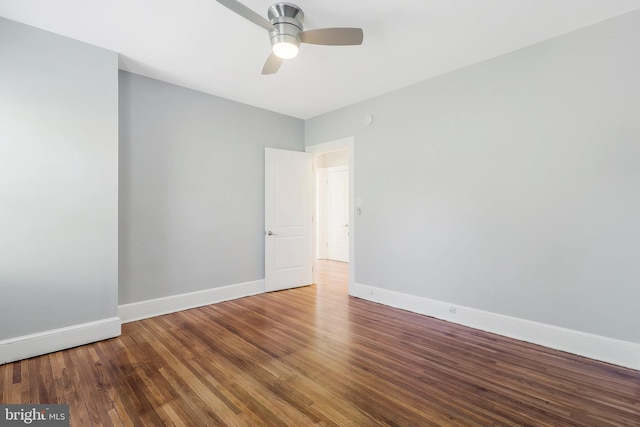 unfurnished room with wood-type flooring and ceiling fan