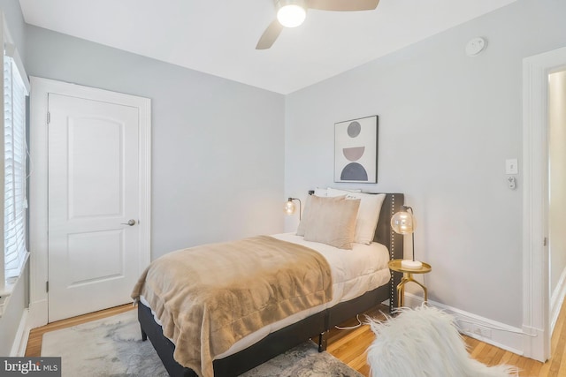 bedroom featuring light wood-type flooring and ceiling fan