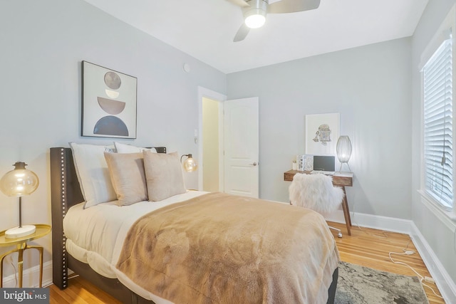 bedroom with hardwood / wood-style flooring and ceiling fan