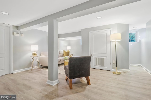 sitting room featuring light hardwood / wood-style floors