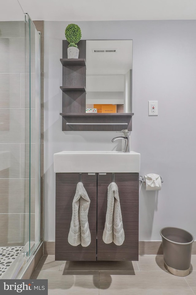 bathroom with vanity and walk in shower