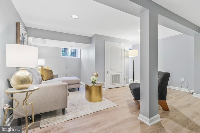 living room with light hardwood / wood-style floors