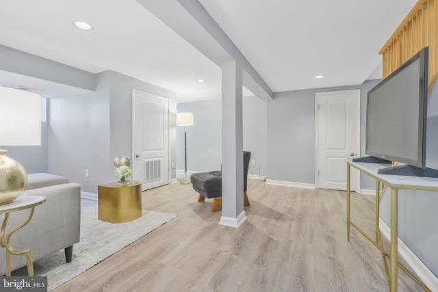 living room with light hardwood / wood-style flooring