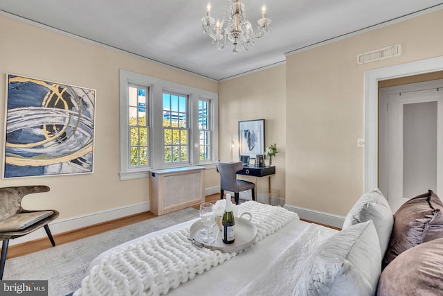 interior space featuring radiator heating unit, ornamental molding, light hardwood / wood-style flooring, and an inviting chandelier