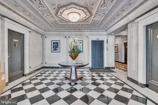 foyer entrance with crown molding and a tray ceiling