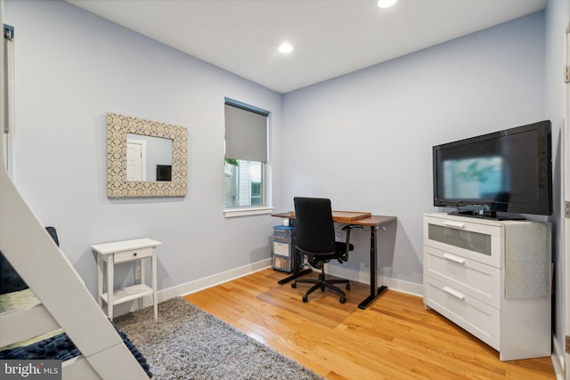 office space with light hardwood / wood-style floors