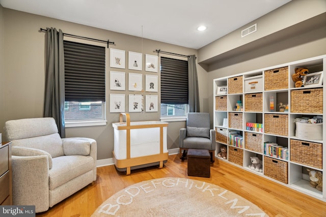 sitting room with hardwood / wood-style floors