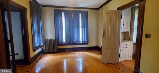 137 S 2nd St, Bangor, PA 18013 - unfurnished room with radiator heating unit, crown molding, wood finished floors, baseboards, and vaulted ceiling