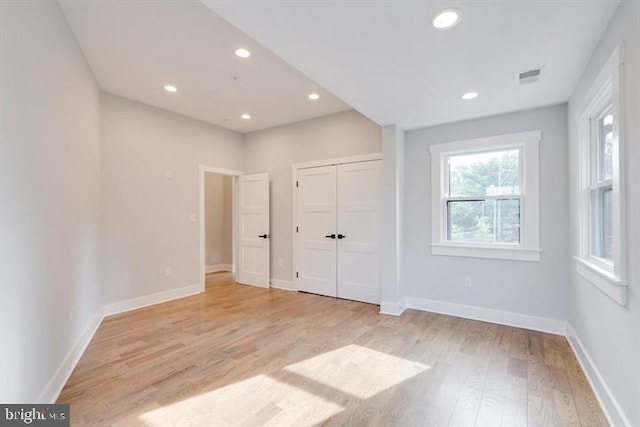 unfurnished bedroom with light hardwood / wood-style flooring