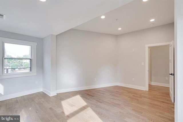 spare room featuring light wood-type flooring