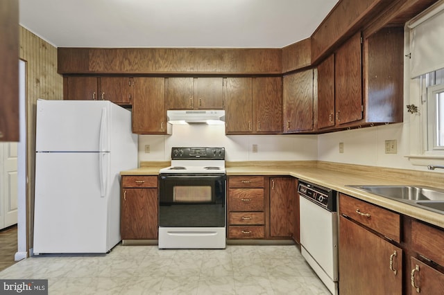 kitchen with sink and white appliances