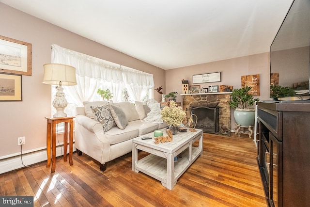 living room featuring a fireplace and wood-type flooring