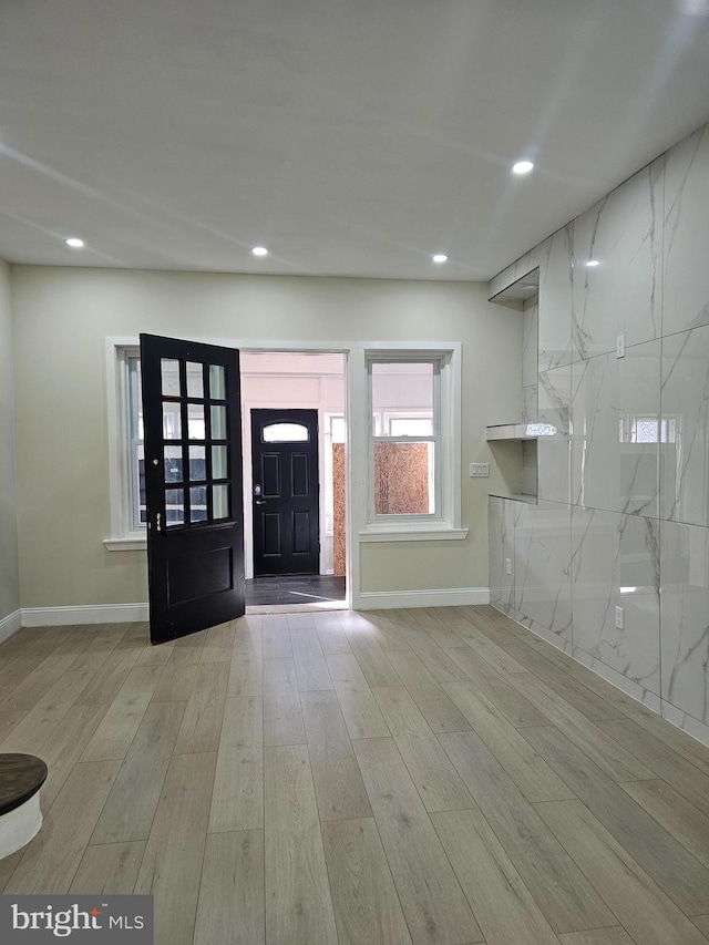 foyer with light wood-type flooring