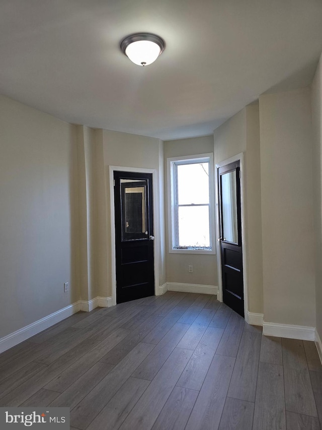 spare room featuring hardwood / wood-style floors