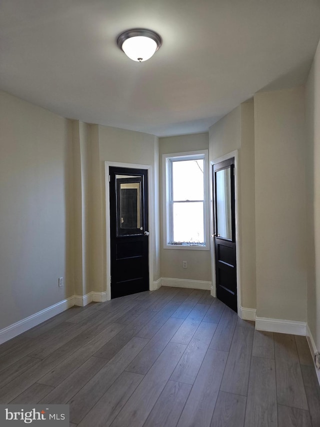 spare room featuring hardwood / wood-style flooring