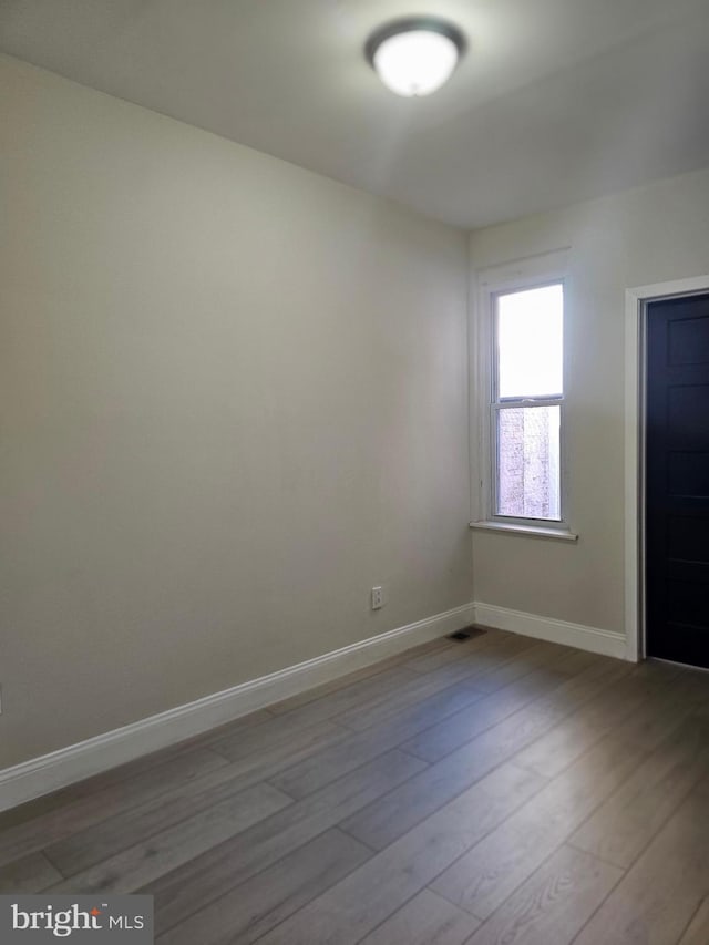 unfurnished room featuring light hardwood / wood-style flooring