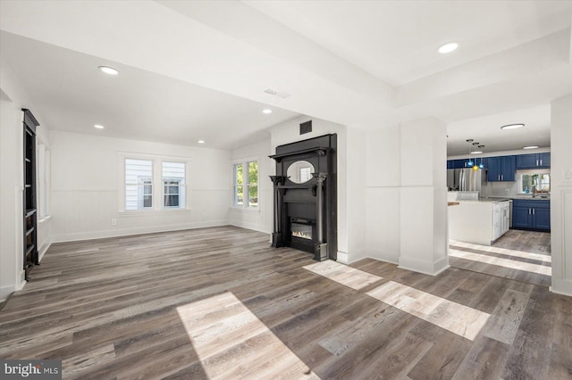 unfurnished living room featuring dark hardwood / wood-style floors