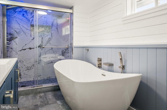 bathroom featuring wooden walls, vanity, and independent shower and bath