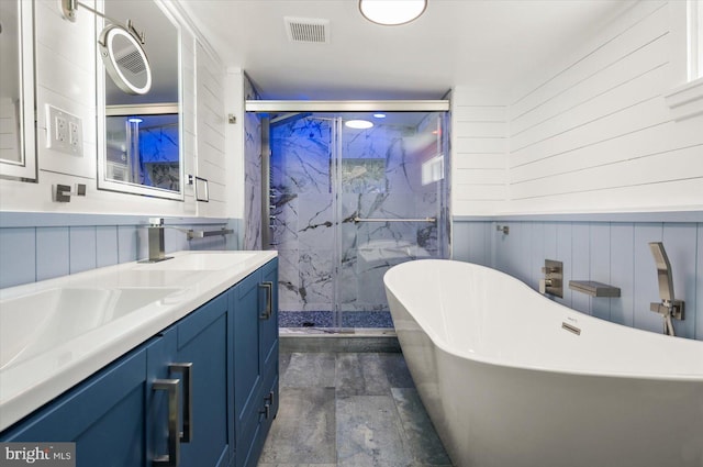 bathroom with vanity and separate shower and tub