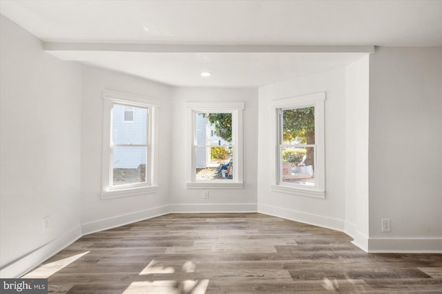 empty room with dark hardwood / wood-style floors