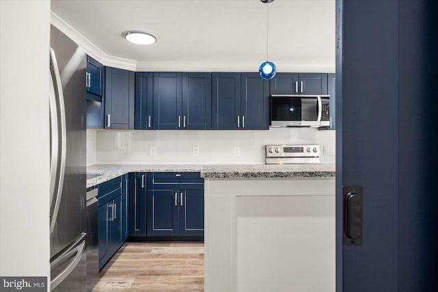 kitchen with light hardwood / wood-style floors, light stone countertops, blue cabinetry, and appliances with stainless steel finishes