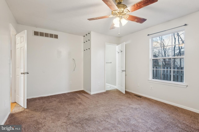 unfurnished bedroom with carpet flooring and ceiling fan