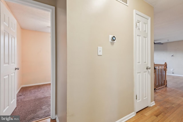 hallway with light wood-type flooring