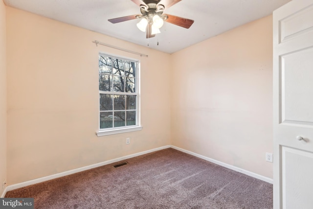 carpeted empty room with ceiling fan