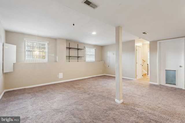 basement with light colored carpet