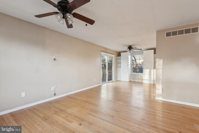 unfurnished living room with ceiling fan and light hardwood / wood-style floors