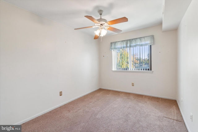 empty room featuring carpet flooring and ceiling fan