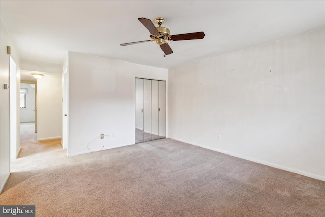 unfurnished bedroom featuring a closet, carpet, and ceiling fan