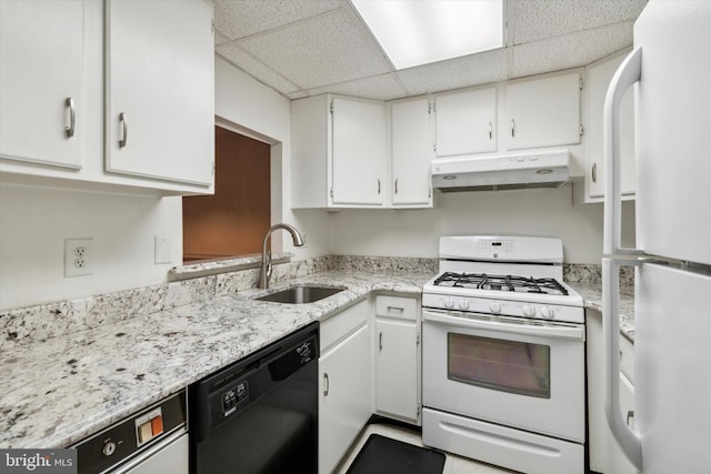 kitchen with white cabinets, sink, a paneled ceiling, and white appliances