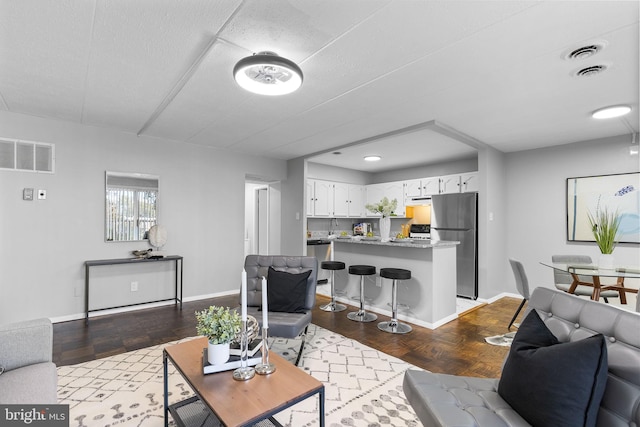 living room with wood-type flooring