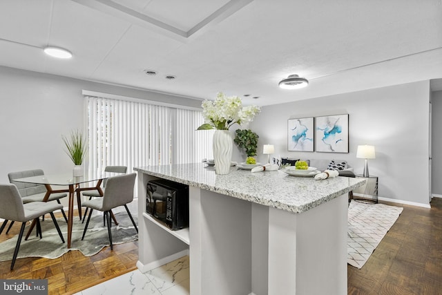 kitchen featuring dark parquet floors