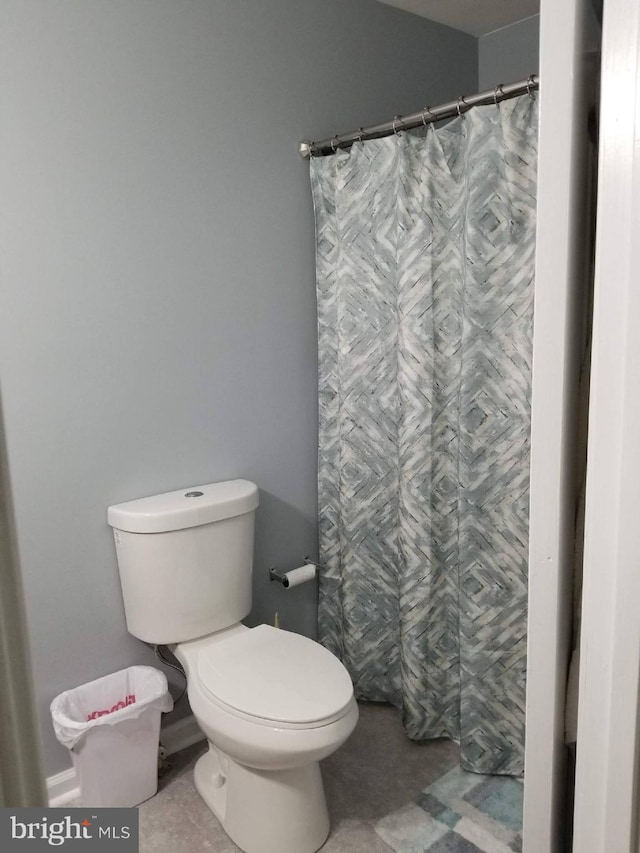 bathroom featuring tile patterned flooring and toilet