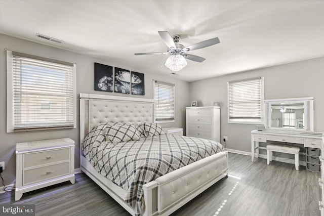 bedroom with dark wood-type flooring and ceiling fan