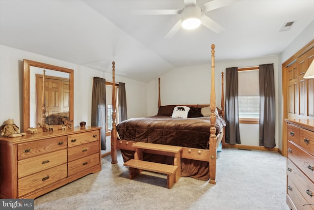 bedroom with ceiling fan, light carpet, and lofted ceiling