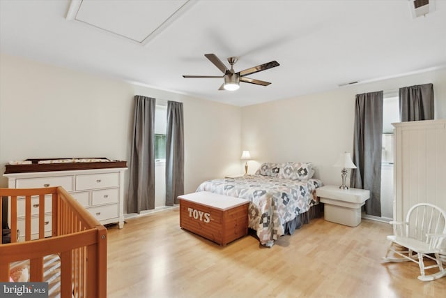 bedroom featuring ceiling fan and light hardwood / wood-style flooring